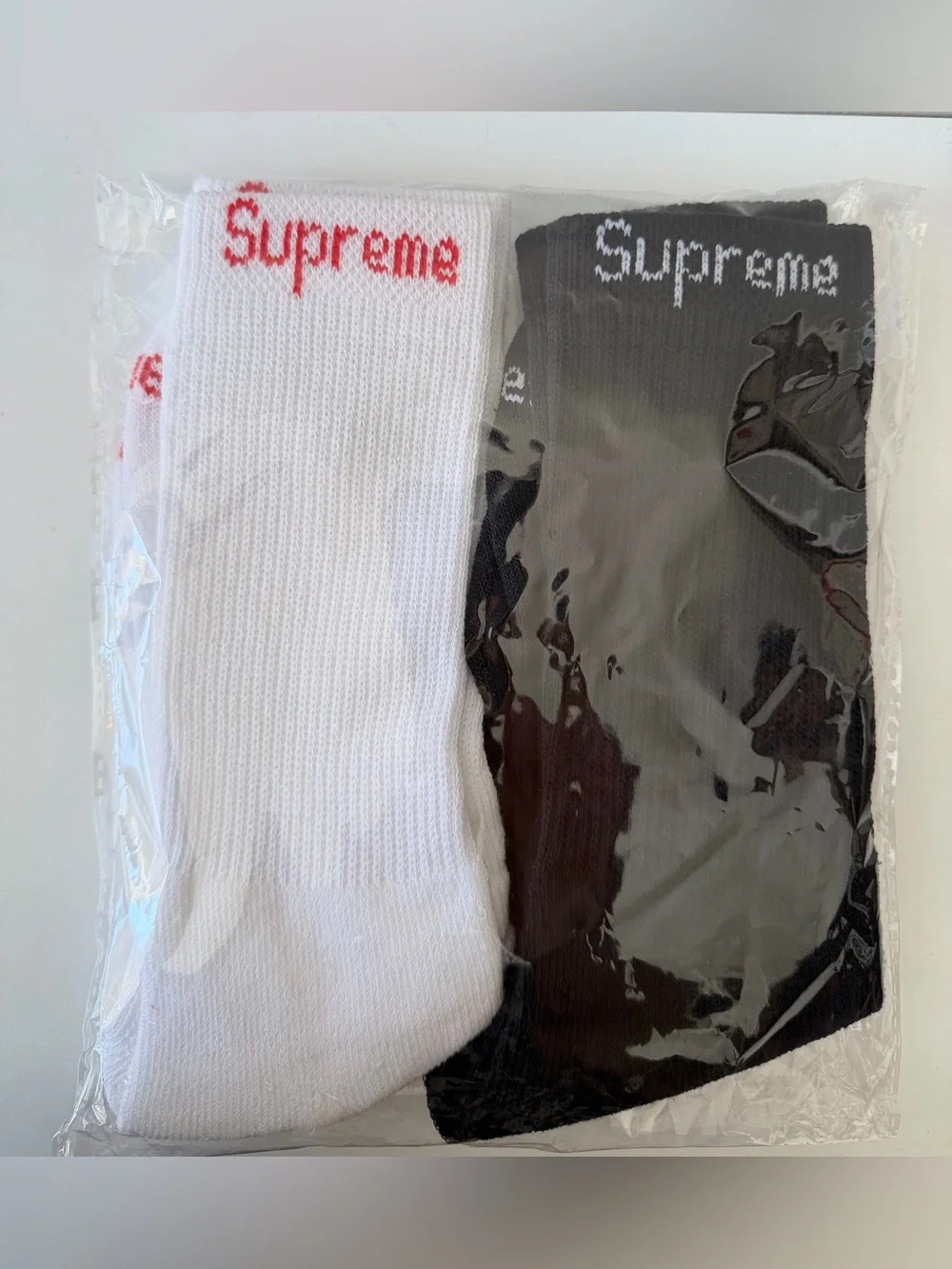 Supreme socks 2 pair one white one black FAST SHIPPINF
